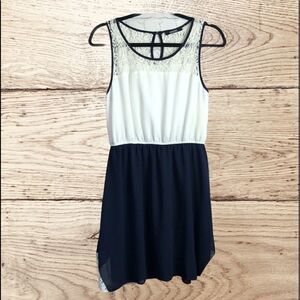 Coco Love. Navy & white A-line knee length dress with lace detail. Med